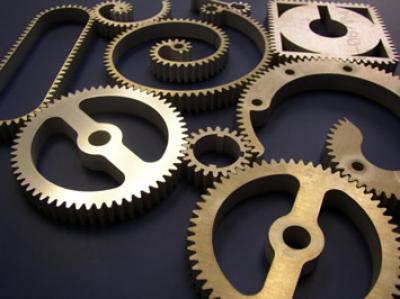 Assortment of metal cog samples manufactured with waterjet cutting