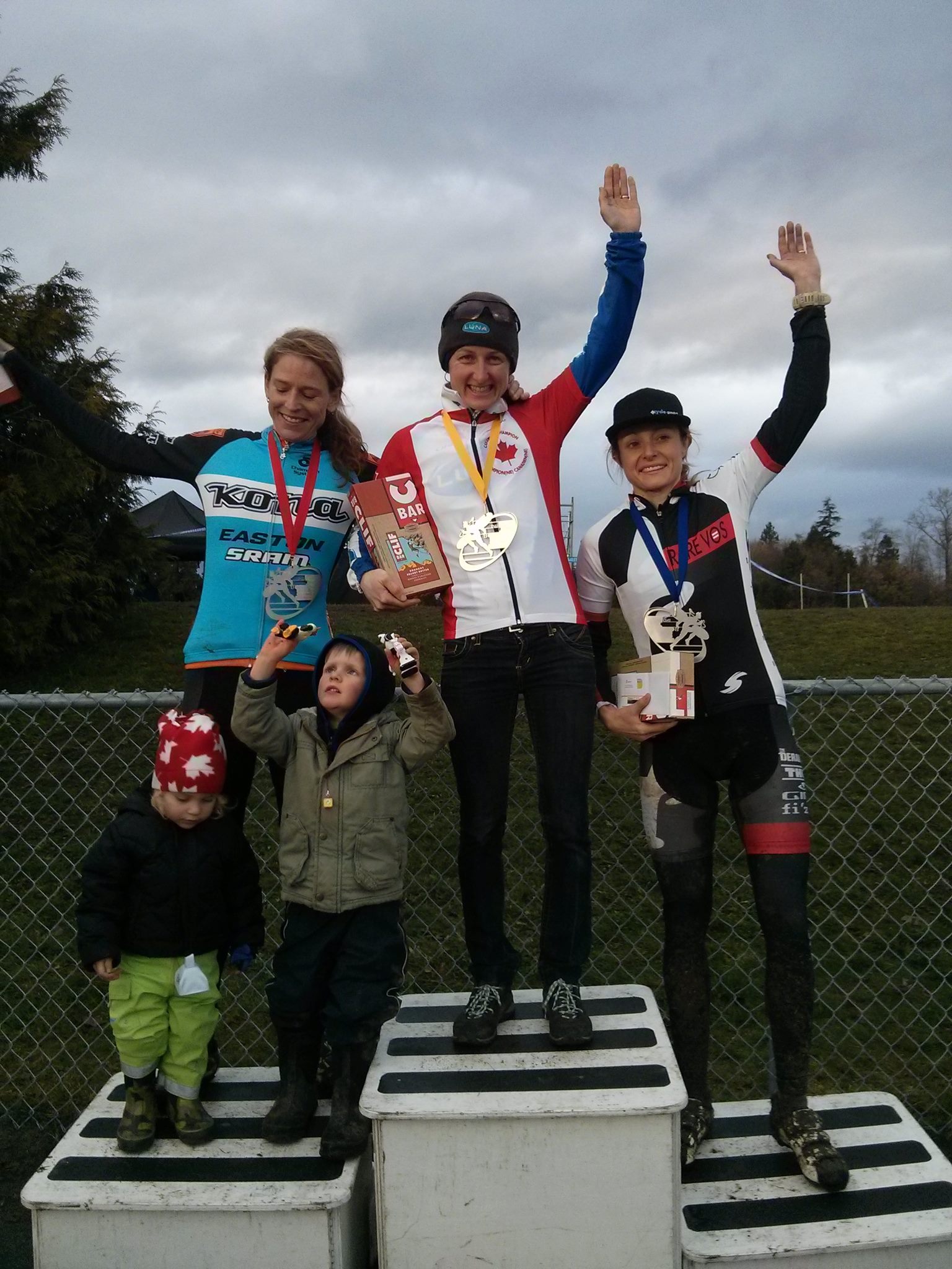 Cyclocross winners sporting medals manufactured by Hansen Industries