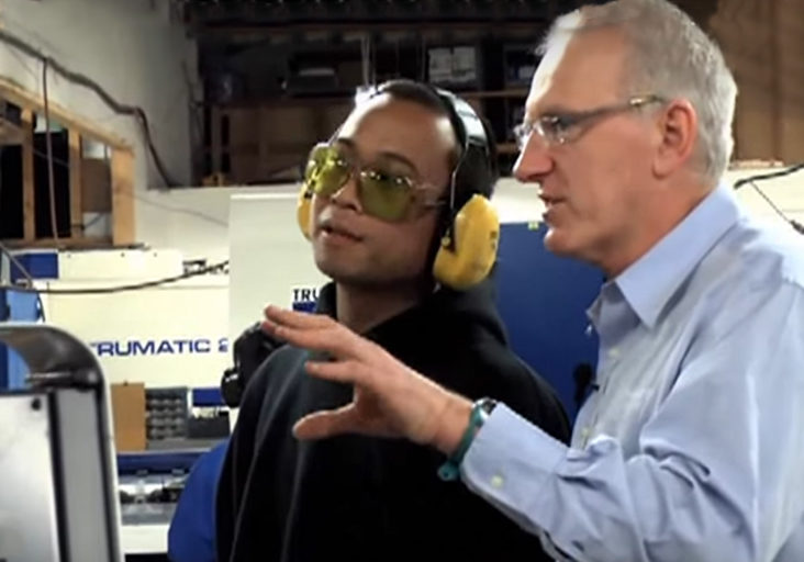 CEO Ed Beange consults with manufacturing employee in sheet metal shop