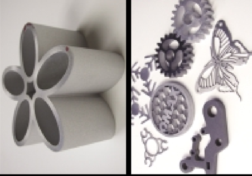 Variety of different metal samples cut with waterjet, including flower, butterly, and cog shapes